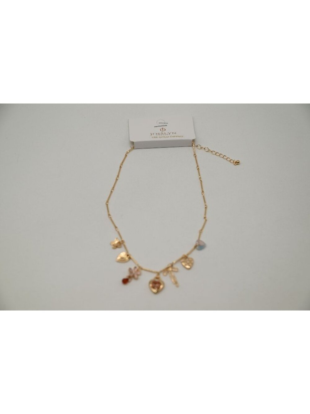 NWT Josslyn Gold Tone Multi Charm Necklace Heart Flower Bow Pendant Feminine
